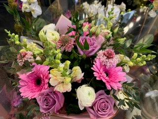 
                    
                      Pink purple rose, Gerber daisies, snaps and ranunculus cheerful bouquet – Jerome Florists NYC
                    
                  