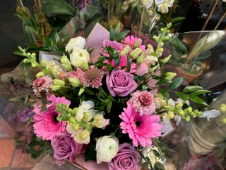 
                    
                      Pink purple rose, Gerber daisies, snaps and ranunculus cheerful bouquet – Jerome Florists NYC
                    
                  