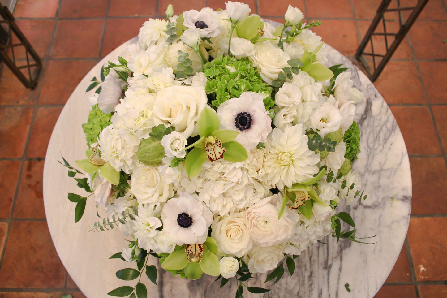 Luxurious white rose, hydrangea, lisianthus, anemones, ranunculus, and orchid arrangement in gold bowl – Jerome Florists NYC