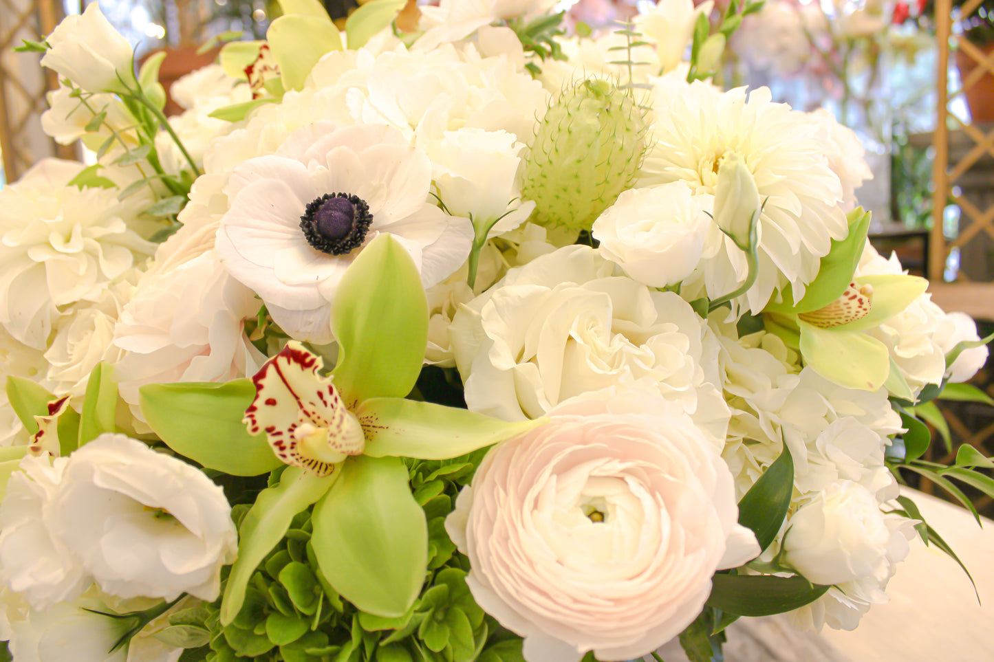
                    
                      Luxurious white rose, hydrangea, lisianthus, anemones, ranunculus, and orchid arrangement in gold bowl – Jerome Florists NYC
                    
                  