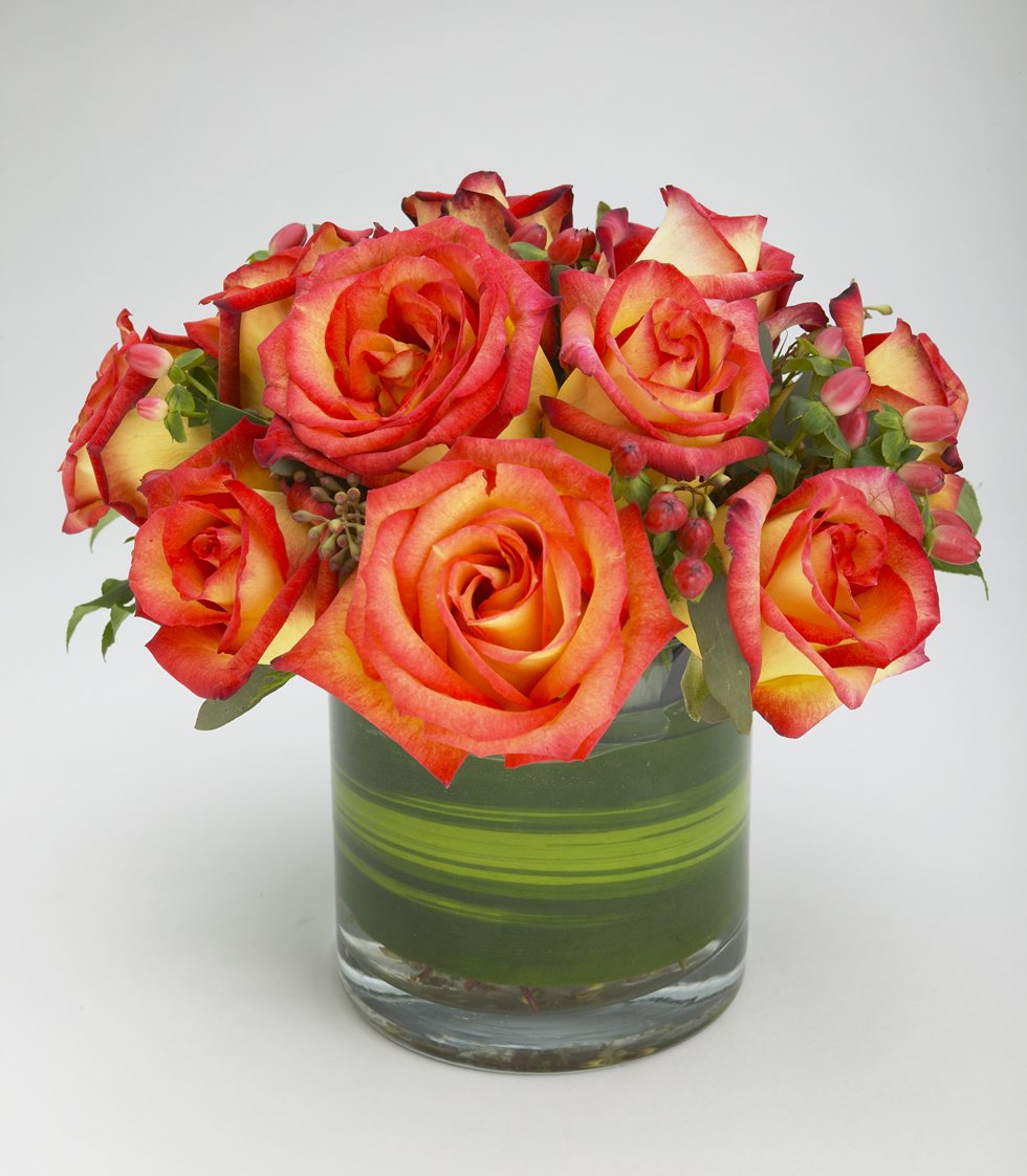 Pink yellow confetti rose arrangement in cylinder vase – Jerome Florists NYC